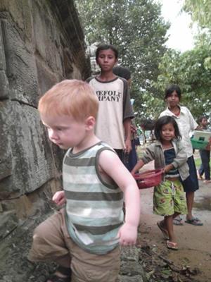 Gavin and local kids at a temple in Cambodia